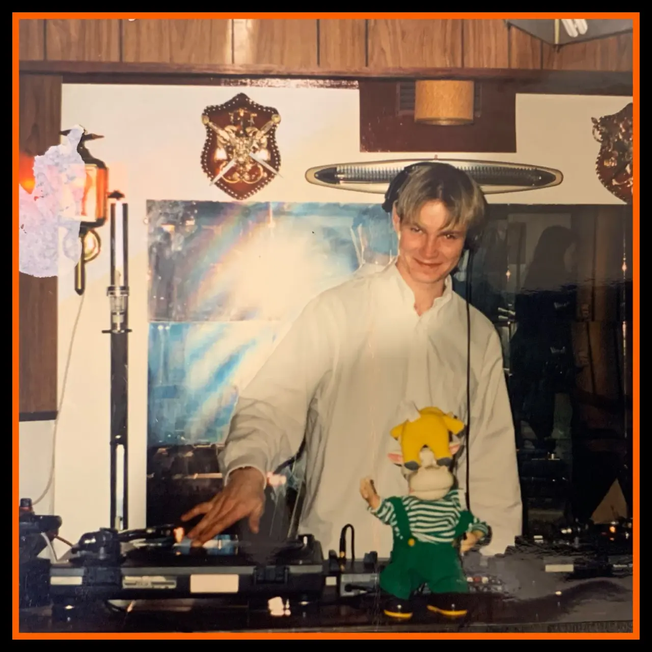 Young DJ HH behind the decks at an early gig